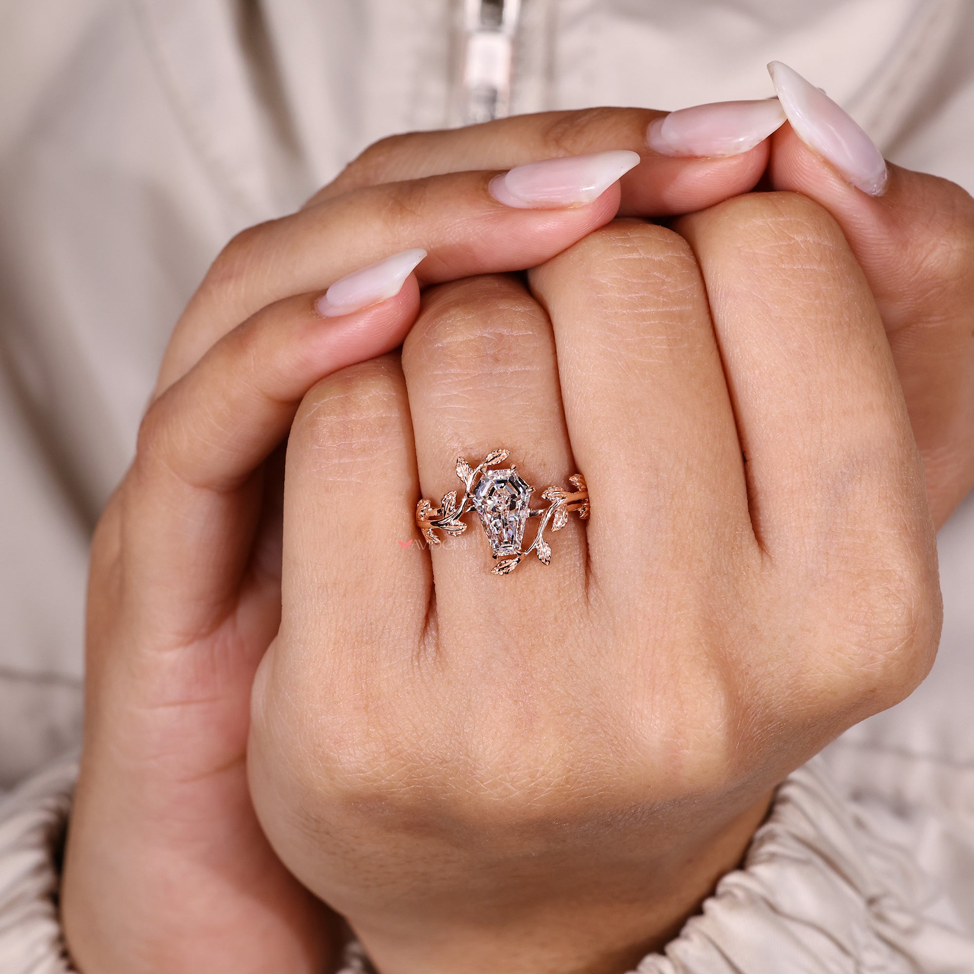 Coffin cut diamond ring with six claw prongs.
