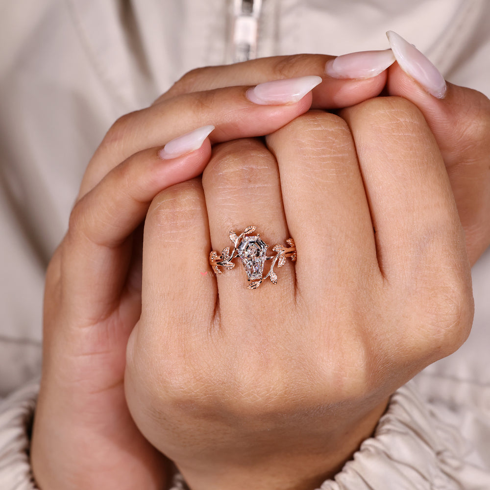 Coffin cut diamond ring with six claw prongs.
