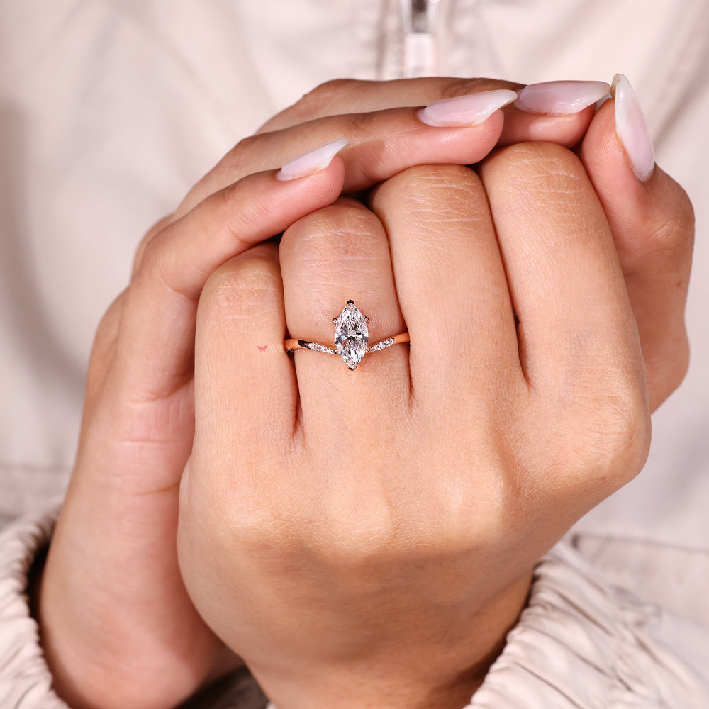 Marquise diamond ring with four claw prong setting.

