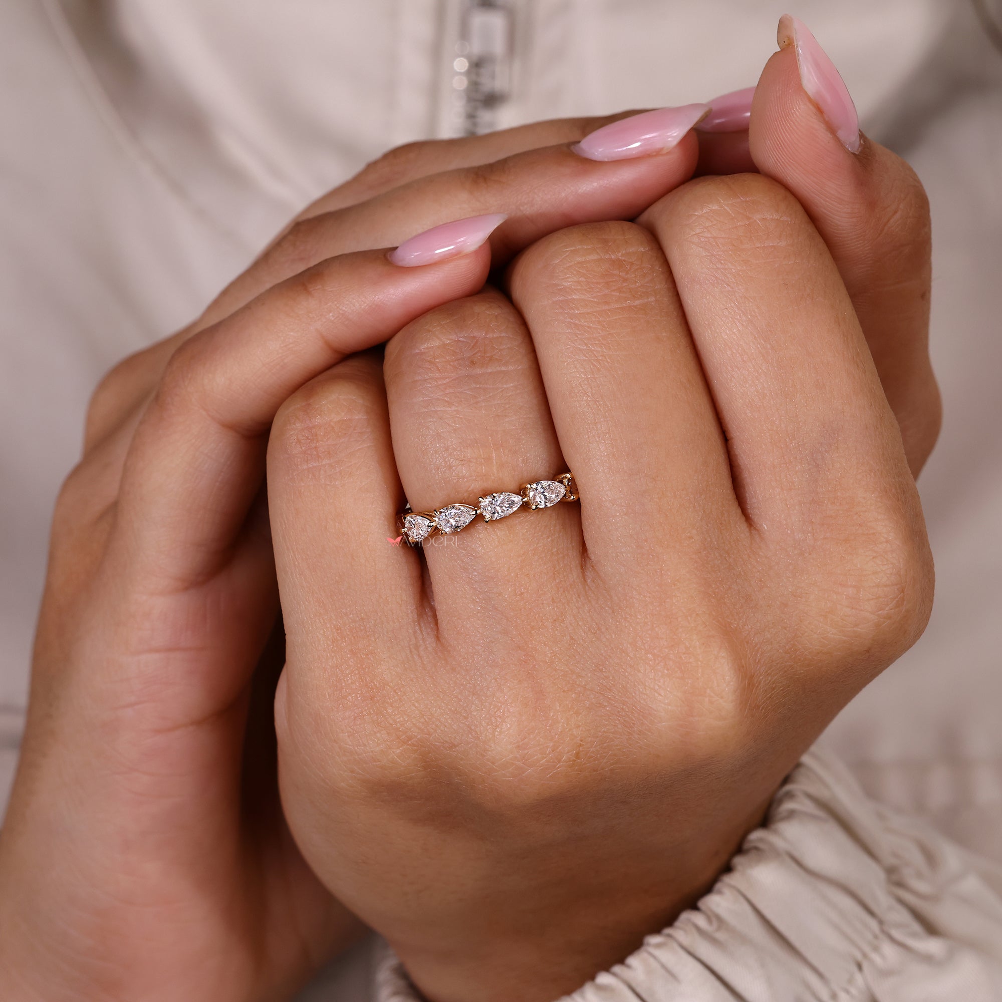 Stackable full eternity band with pear cut diamonds.
