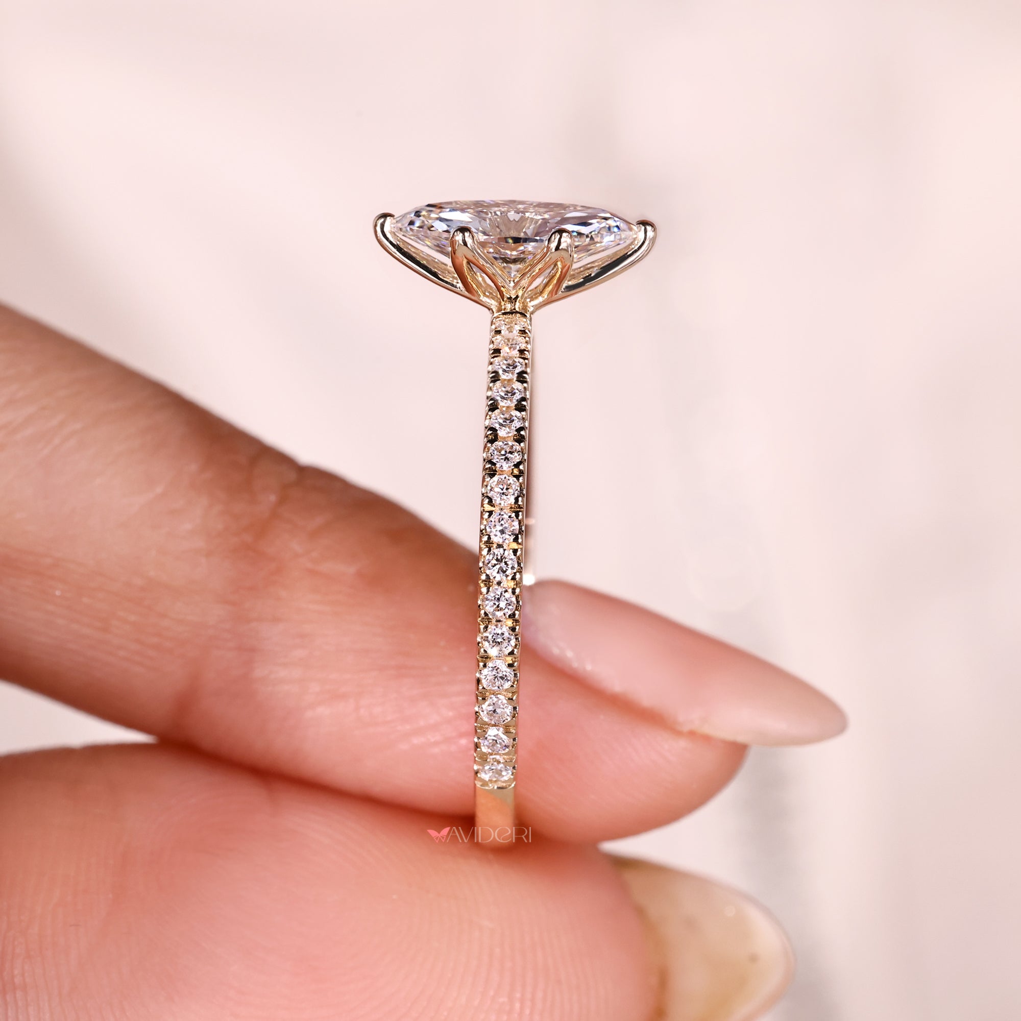 Lab grown marquise diamond ring with six prongs.
