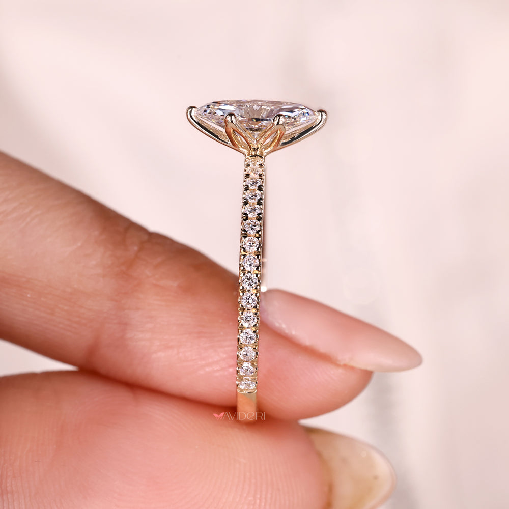 Lab grown marquise diamond ring with six prongs.
