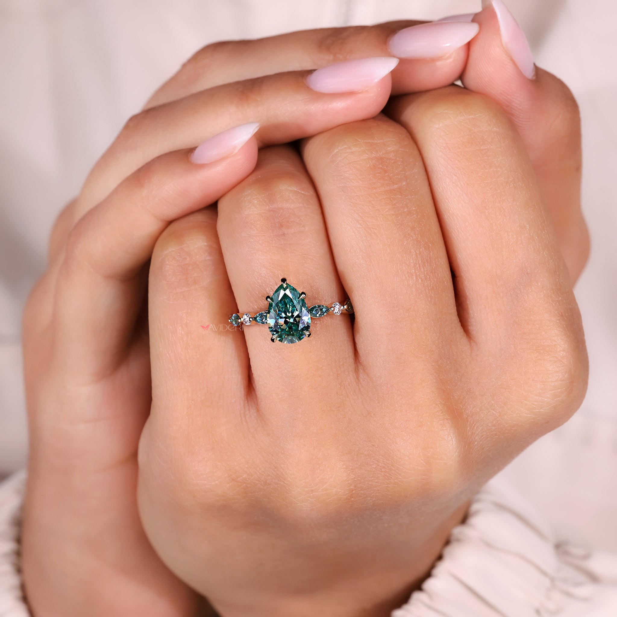 Ring with marquise round side stones design.
