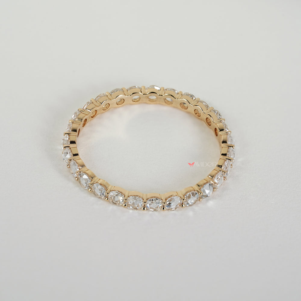 Eternity wedding band featuring round rose diamonds in prongs
