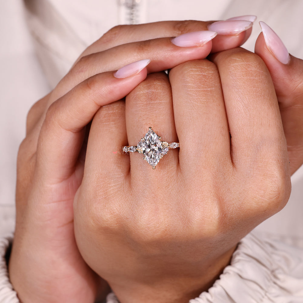 Nature style marquise diamond ring cathedral.
