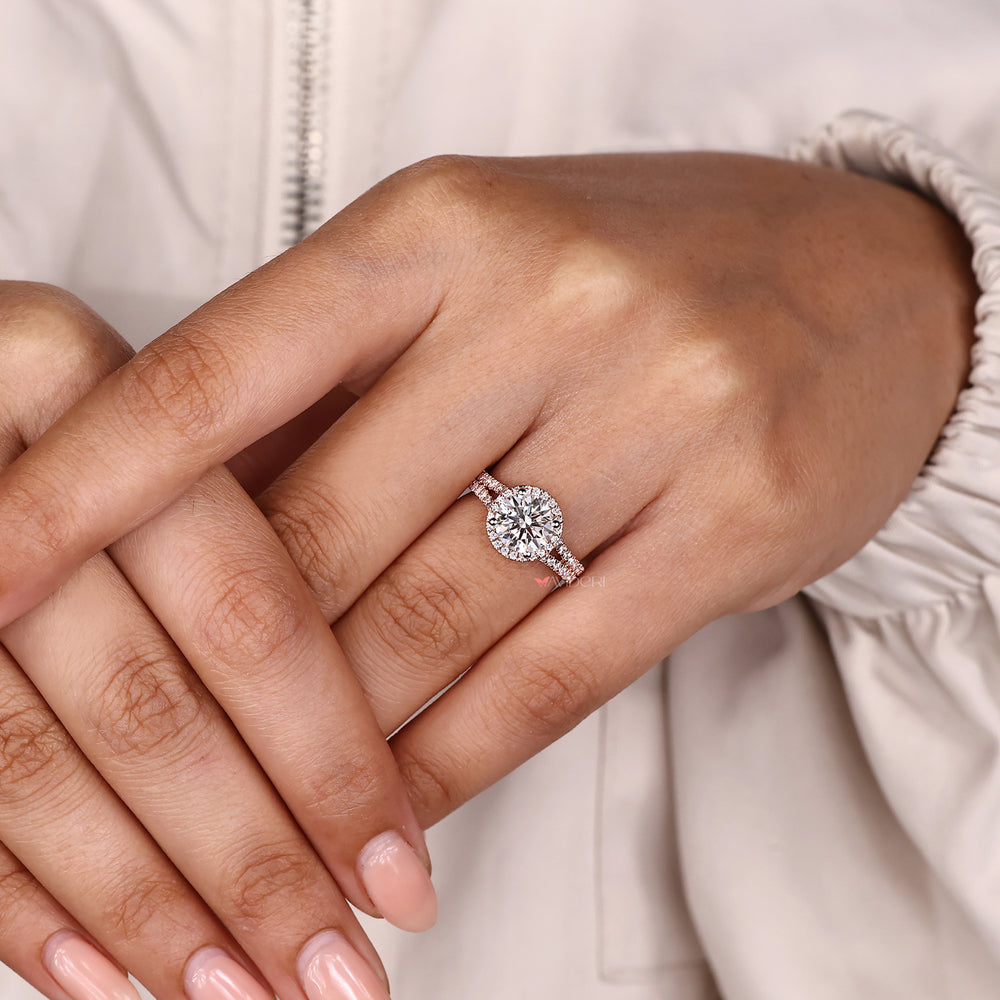 Round diamond ring with halo and prong setting.
