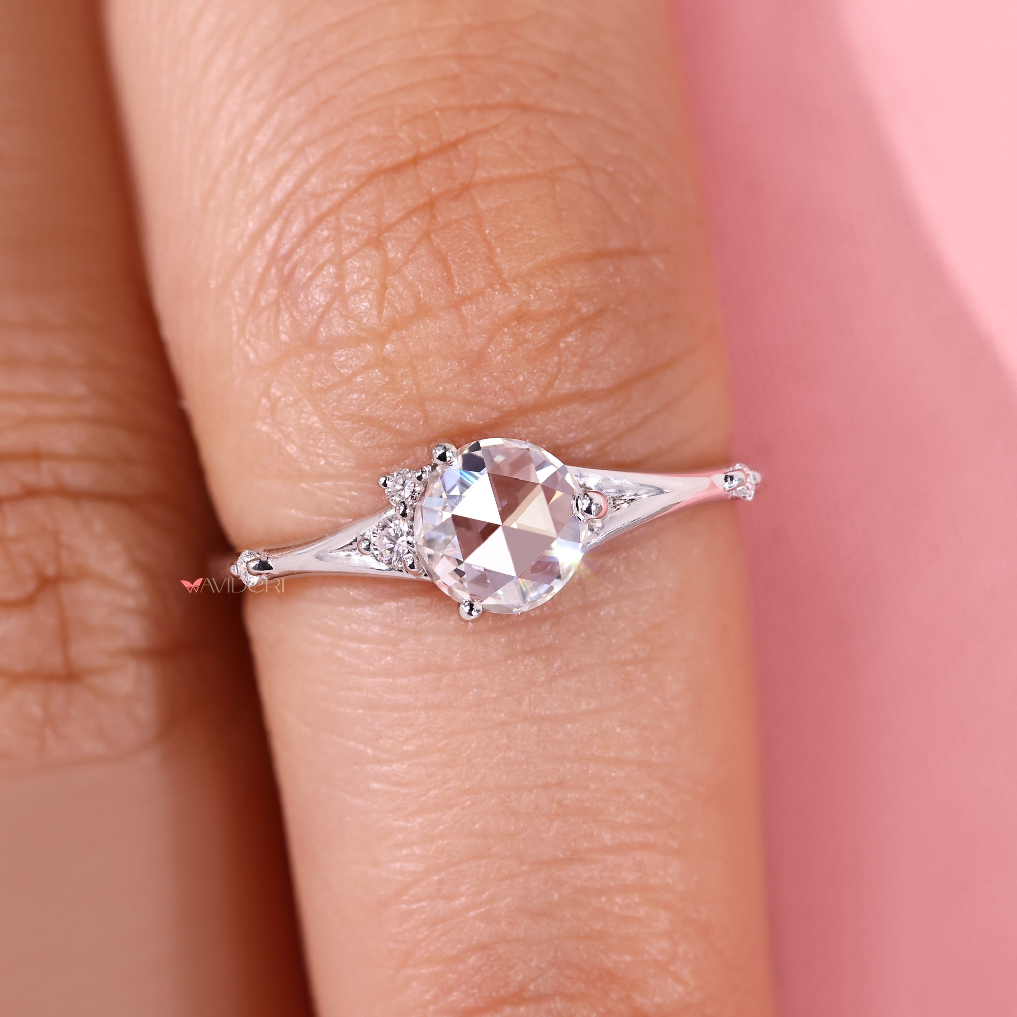 Round diamond five stone ring with side stones.
