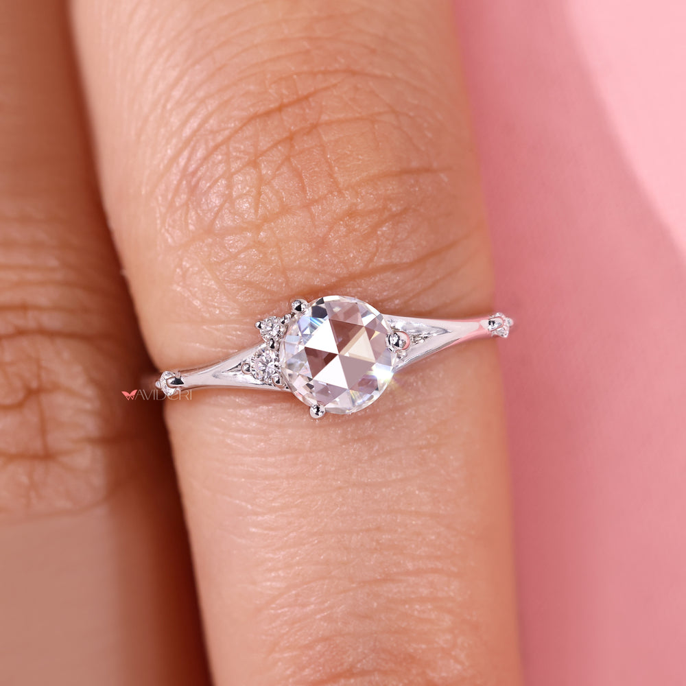 Round diamond five stone ring with side stones.
