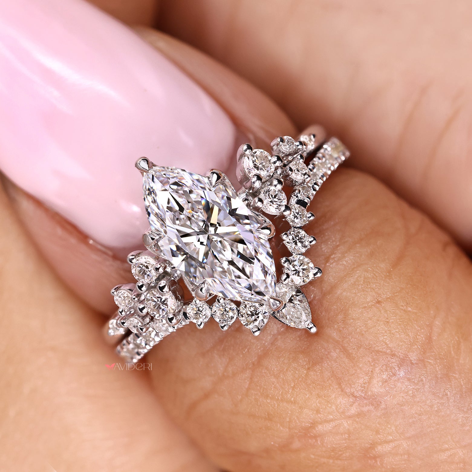 Marquise diamond ring with tulip setting and semi eternity band
