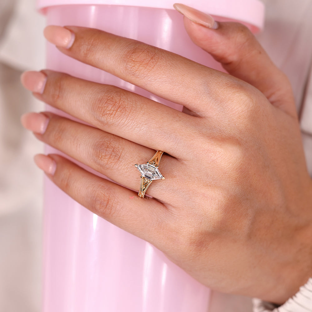 Hexagon diamond ring with cathedral and milgrain setting.
