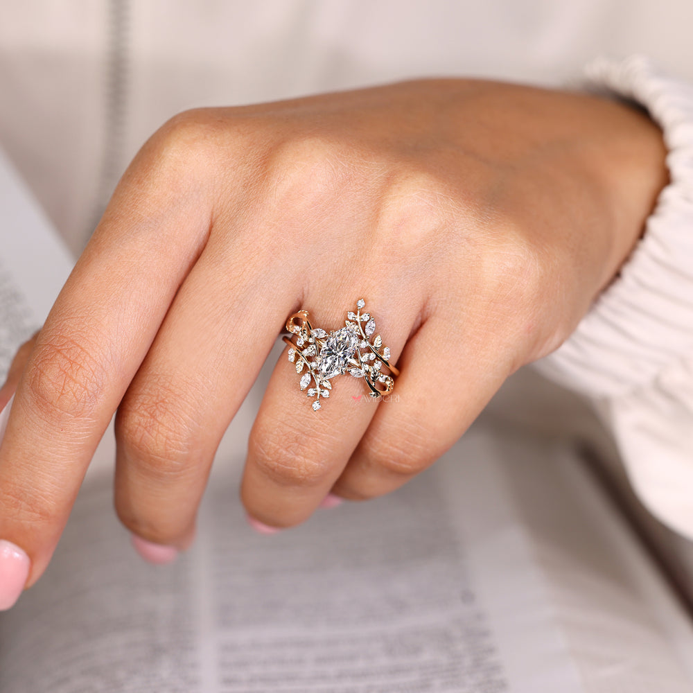 Marquise ring with leaf prongs and enhancer.
