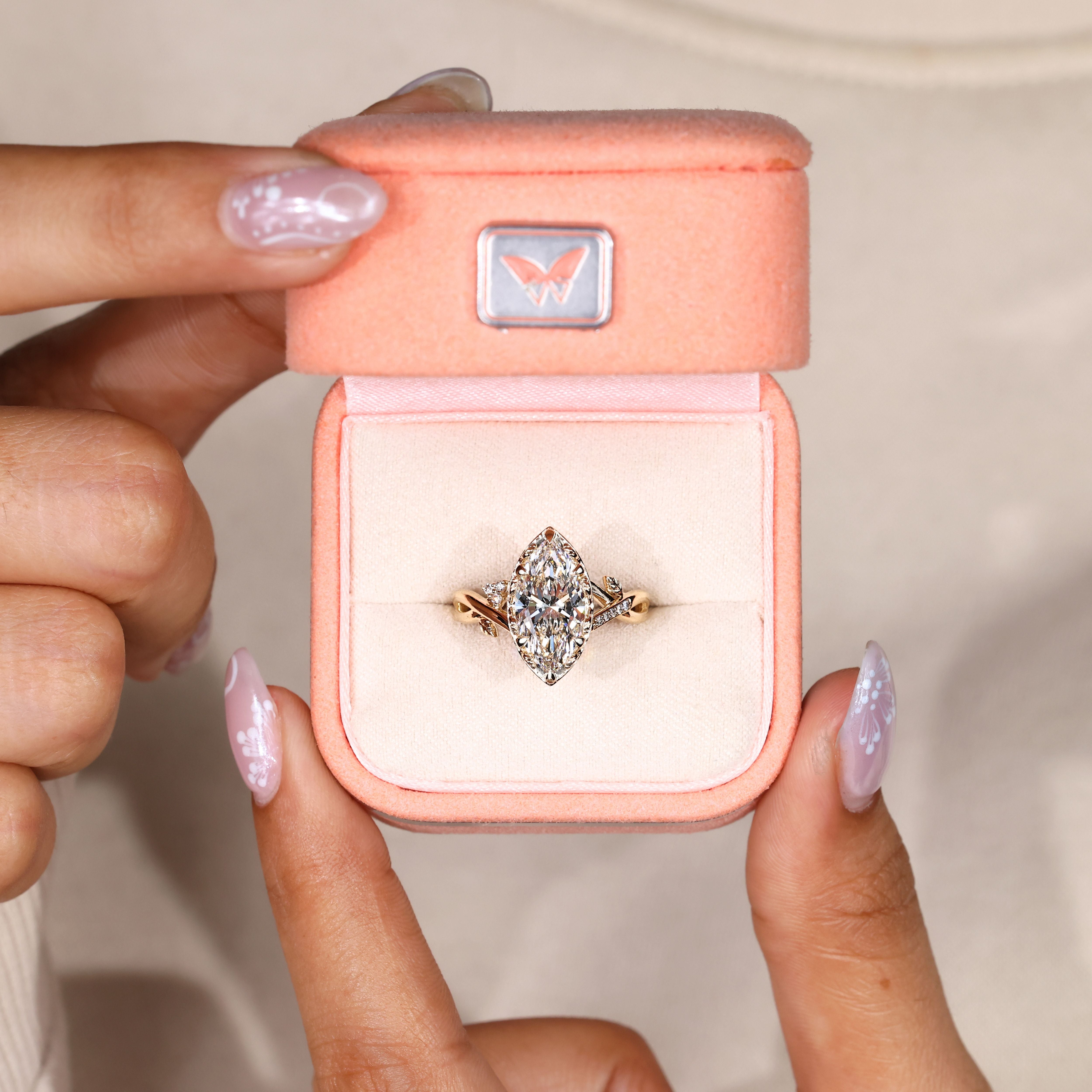 Marquise diamond ring with vintage filigree basket.
