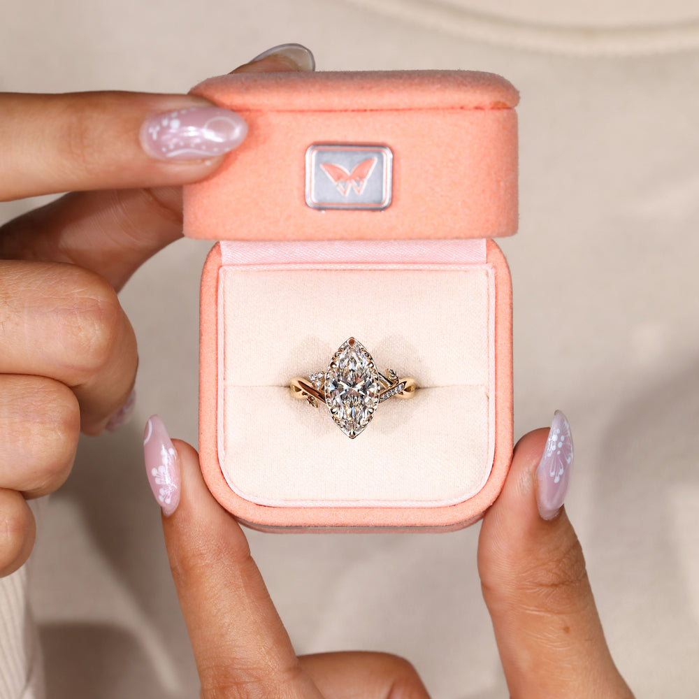 Marquise diamond ring with vintage filigree basket.
