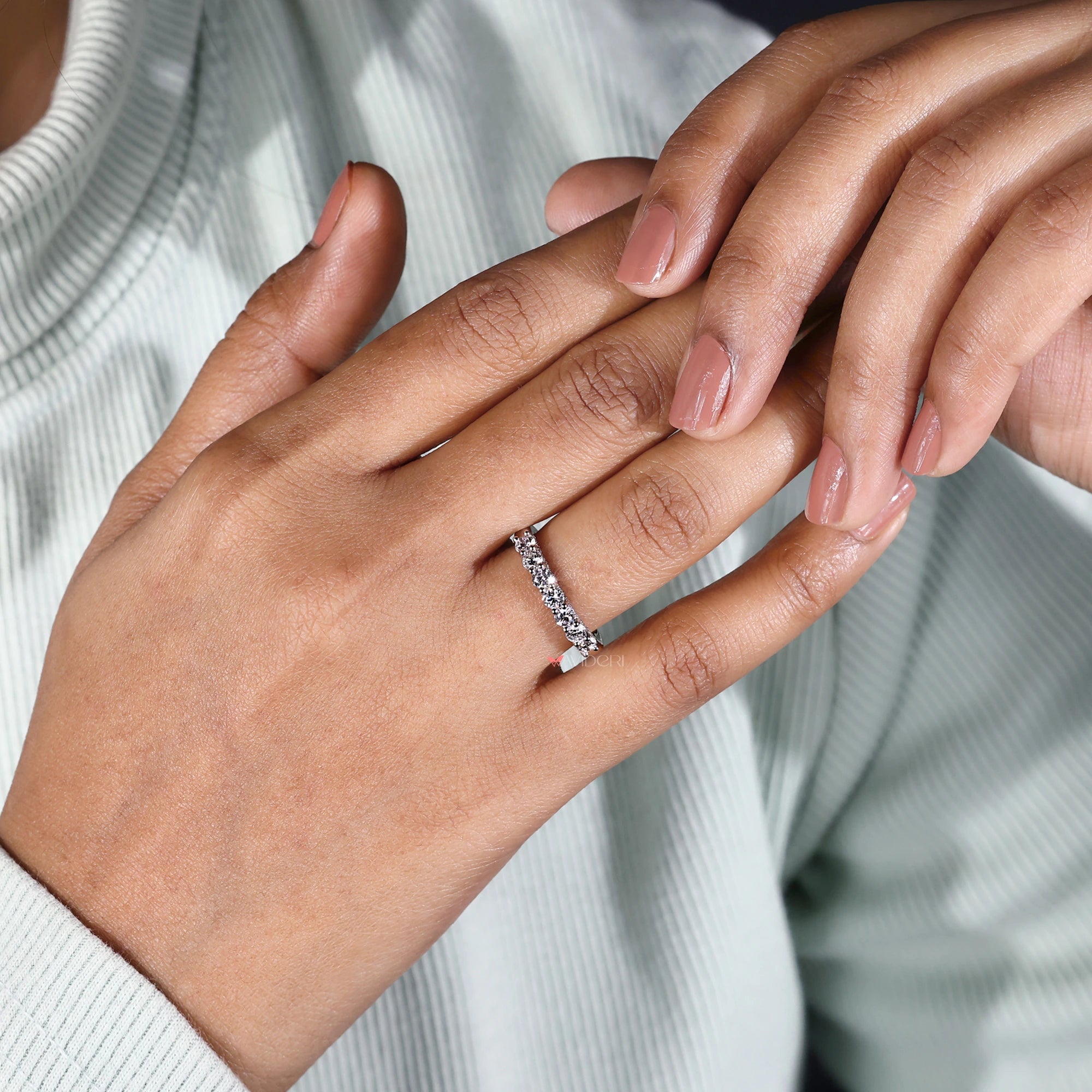 Round diamond wedding band with hidden micro pave setting.