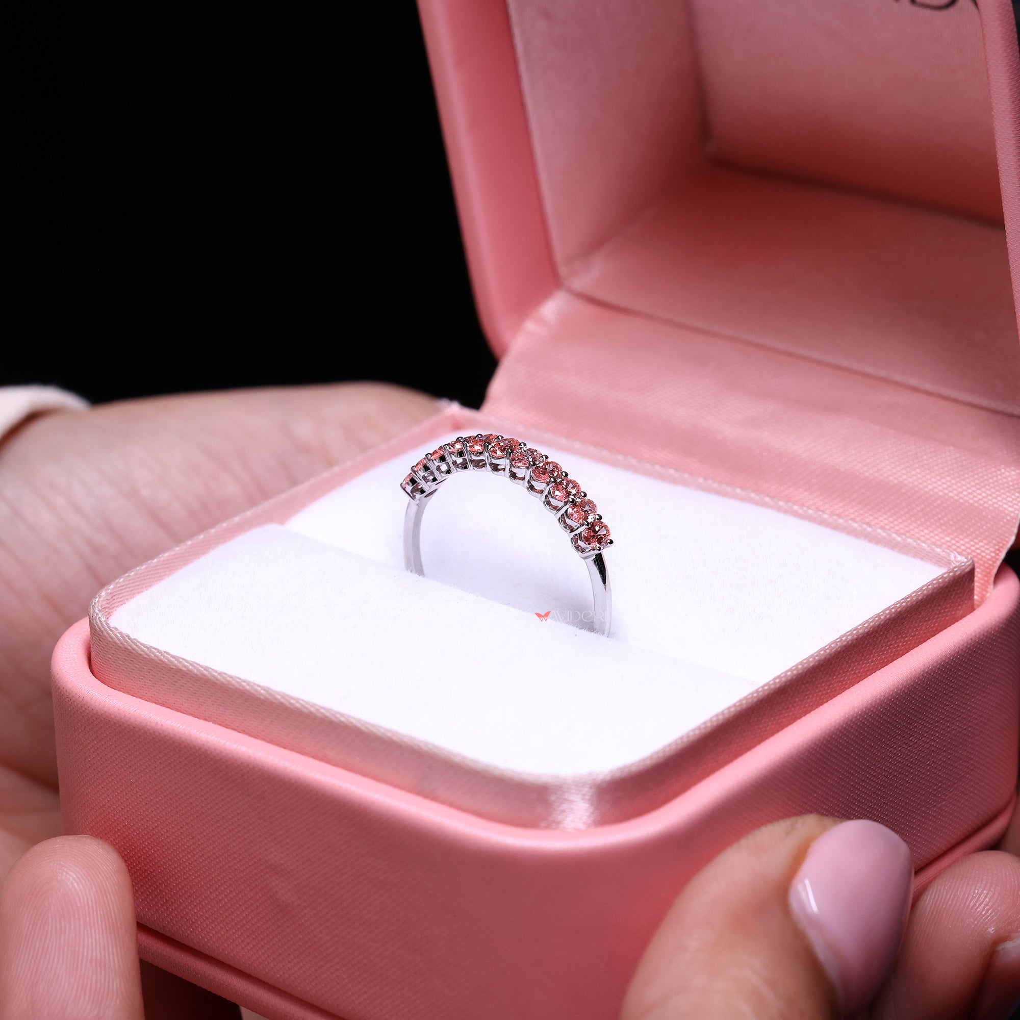 Handmade oval diamond wedding band in polished white gold.