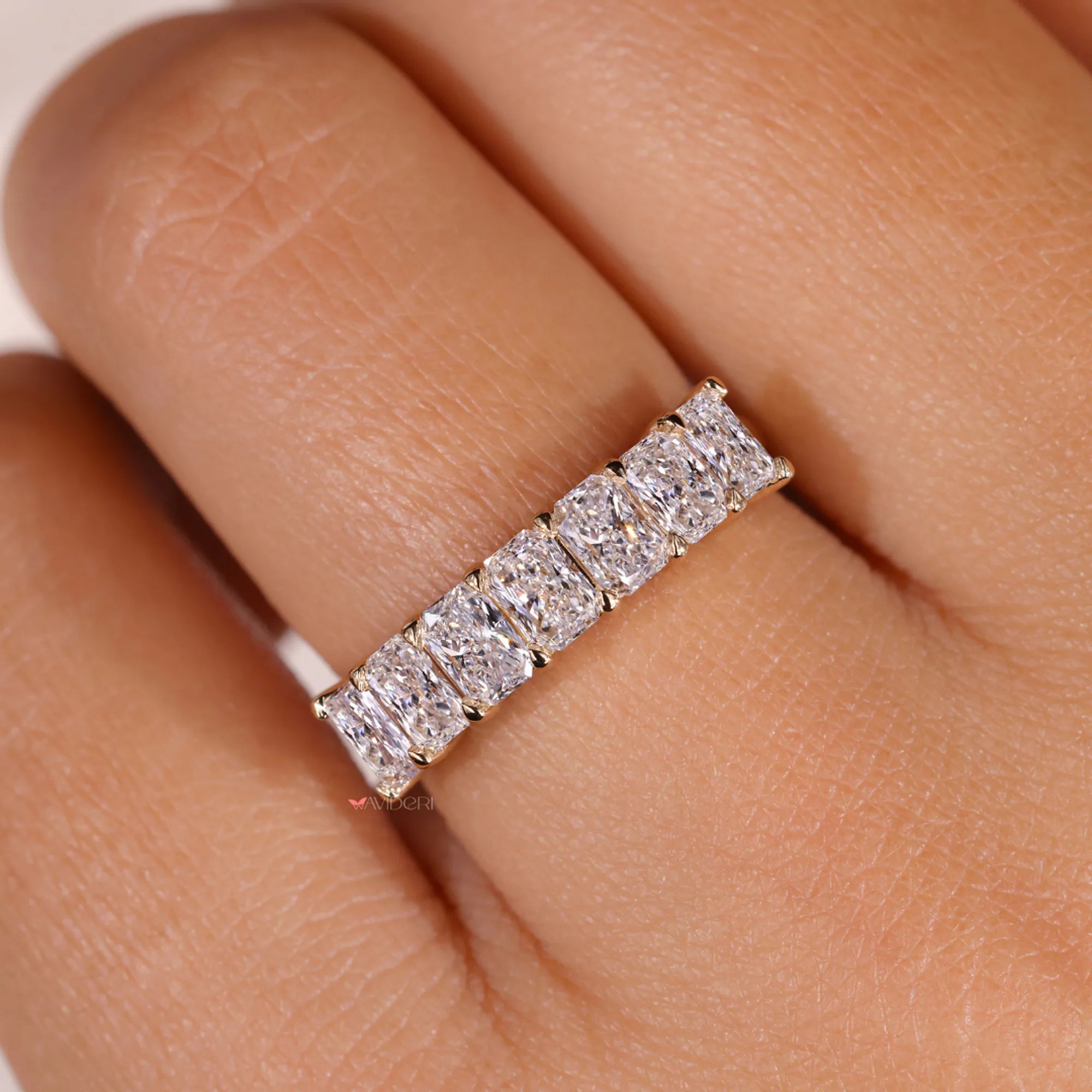 Avideri wedding band with radiant cut wedding band.
