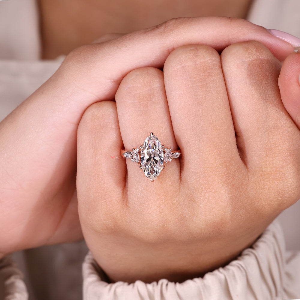 Moval diamond ring with six claw prongs.
