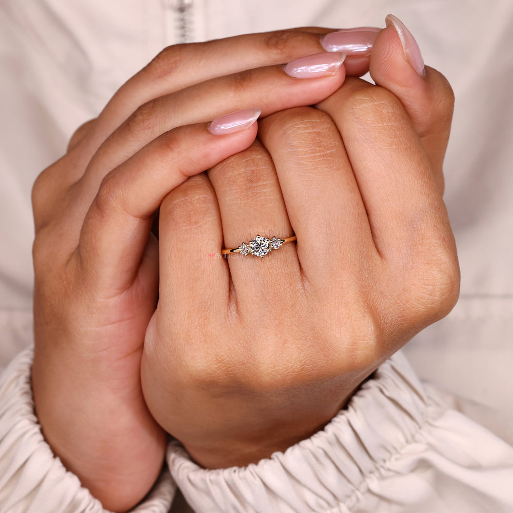 Lab grown diamond round ring three stone style.
