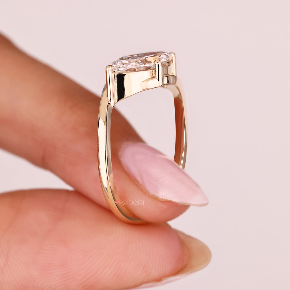 East to west marquise diamond ring solitaire.
