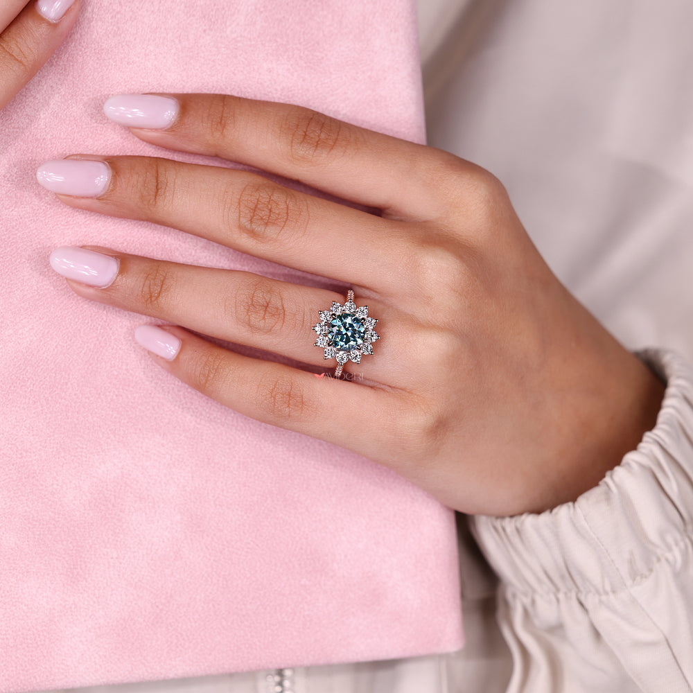 Round moissanite ring with prong setting design.

