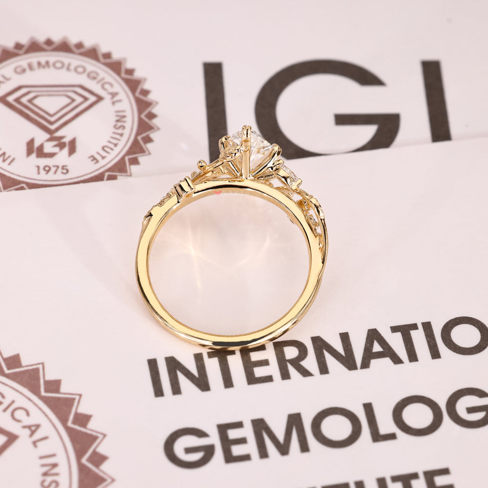 Lab grown marquise diamond ring with side stone accents.
