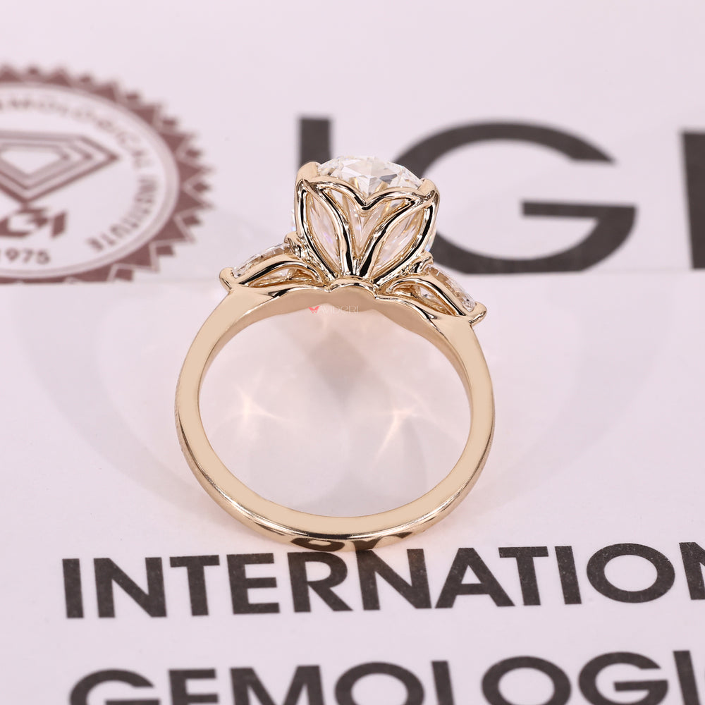Lab grown oval diamond three stone engagement ring.
