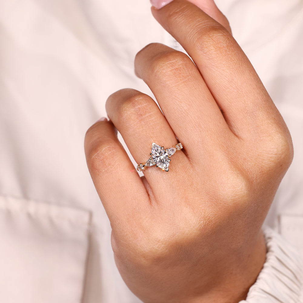Handmade marquise diamond ring with pave.
