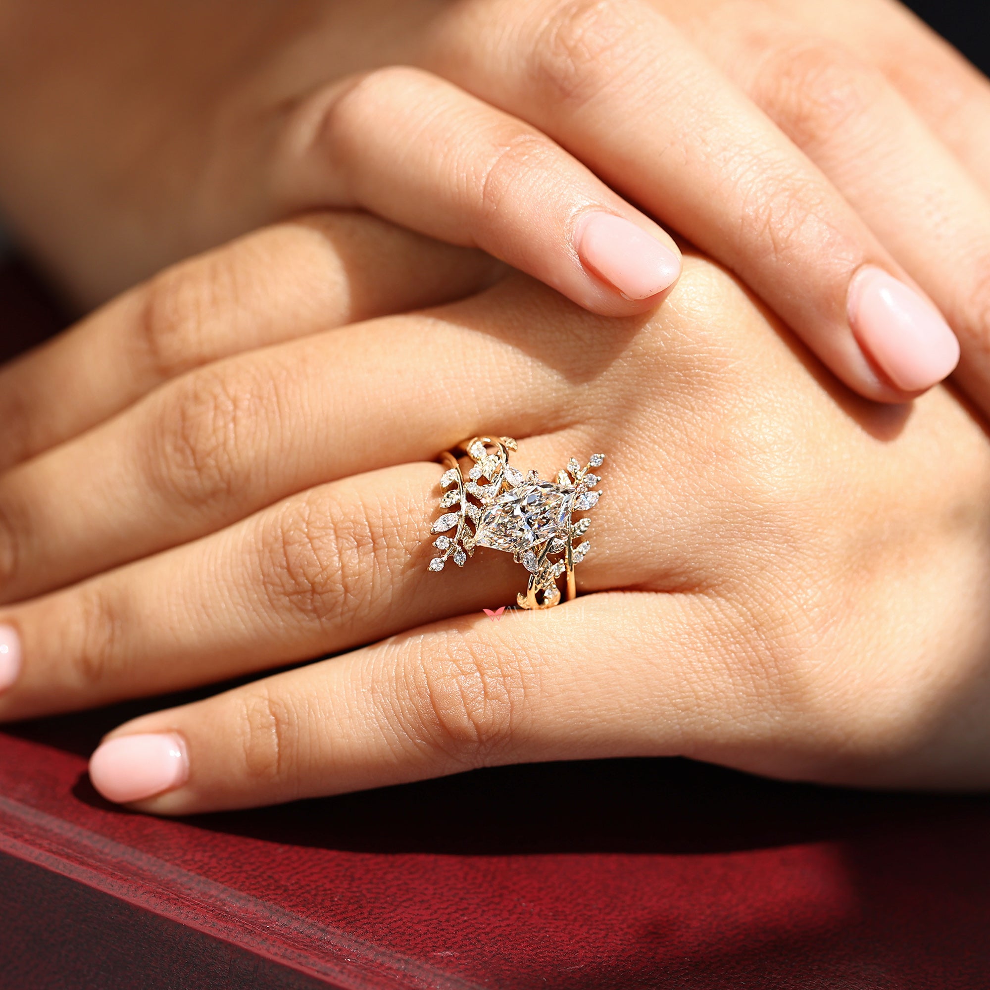 6 leaf style prong in marquise and round side stone.