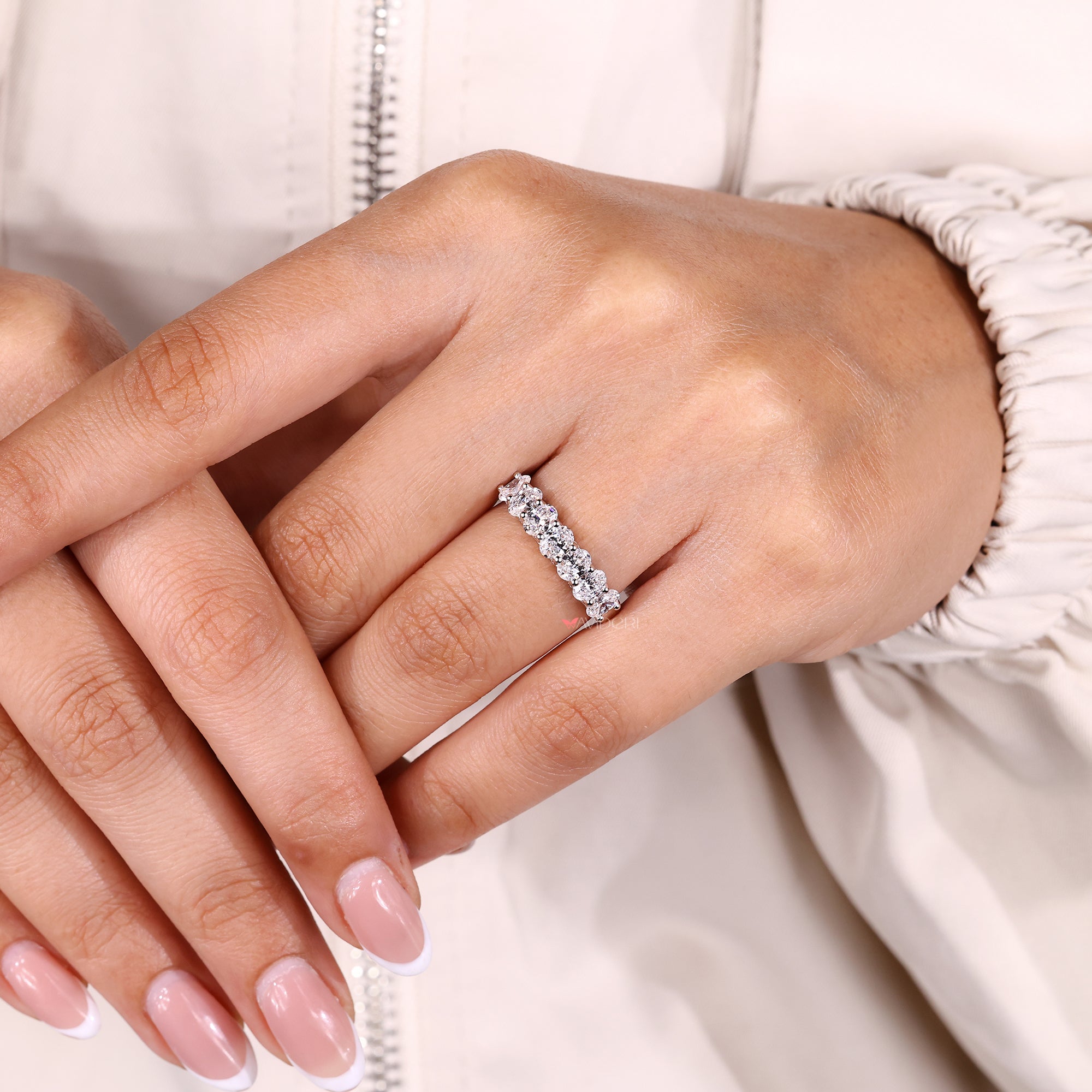 Buy a wedding band with lab grown diamond.