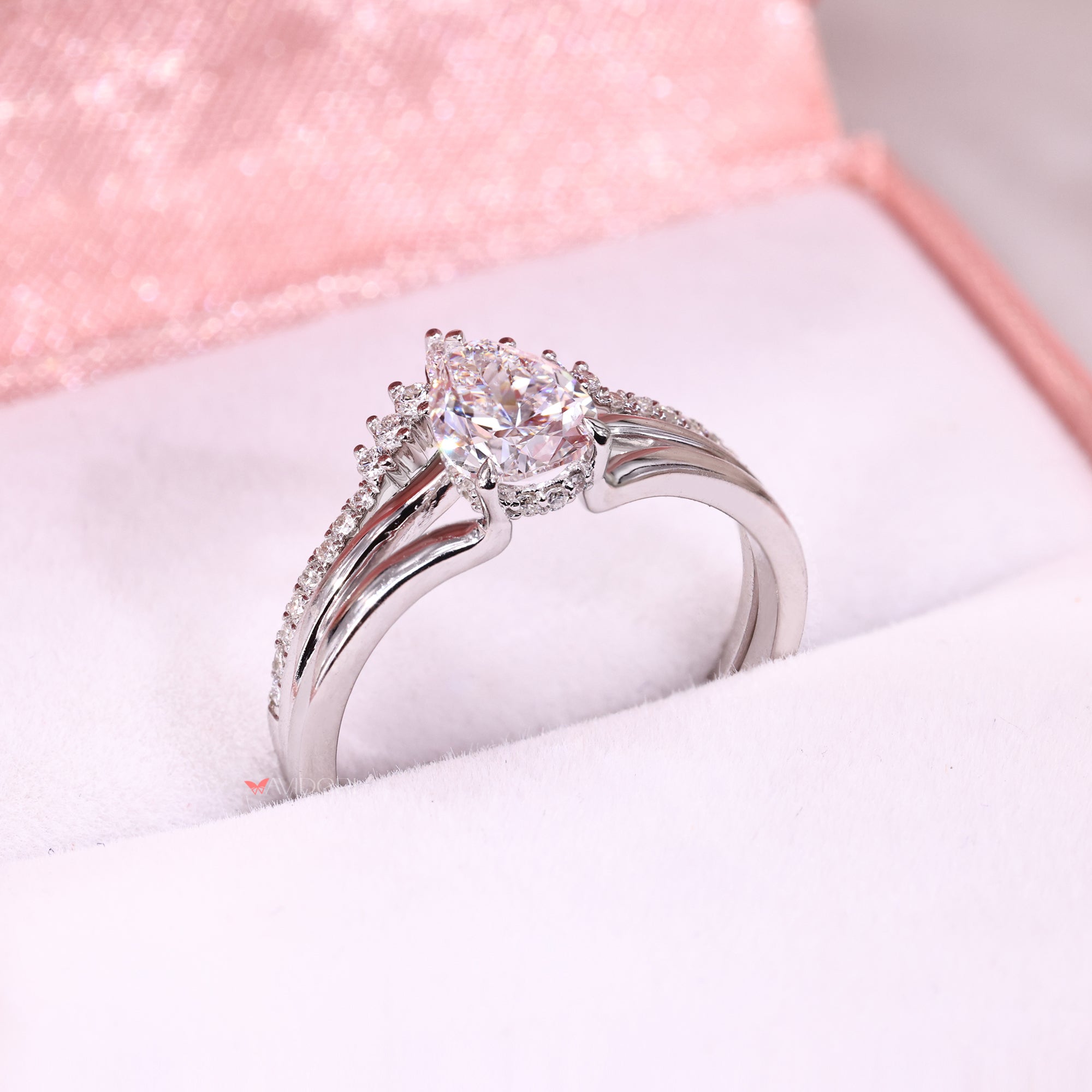 Hidden halo engagement ring with three prong setting.