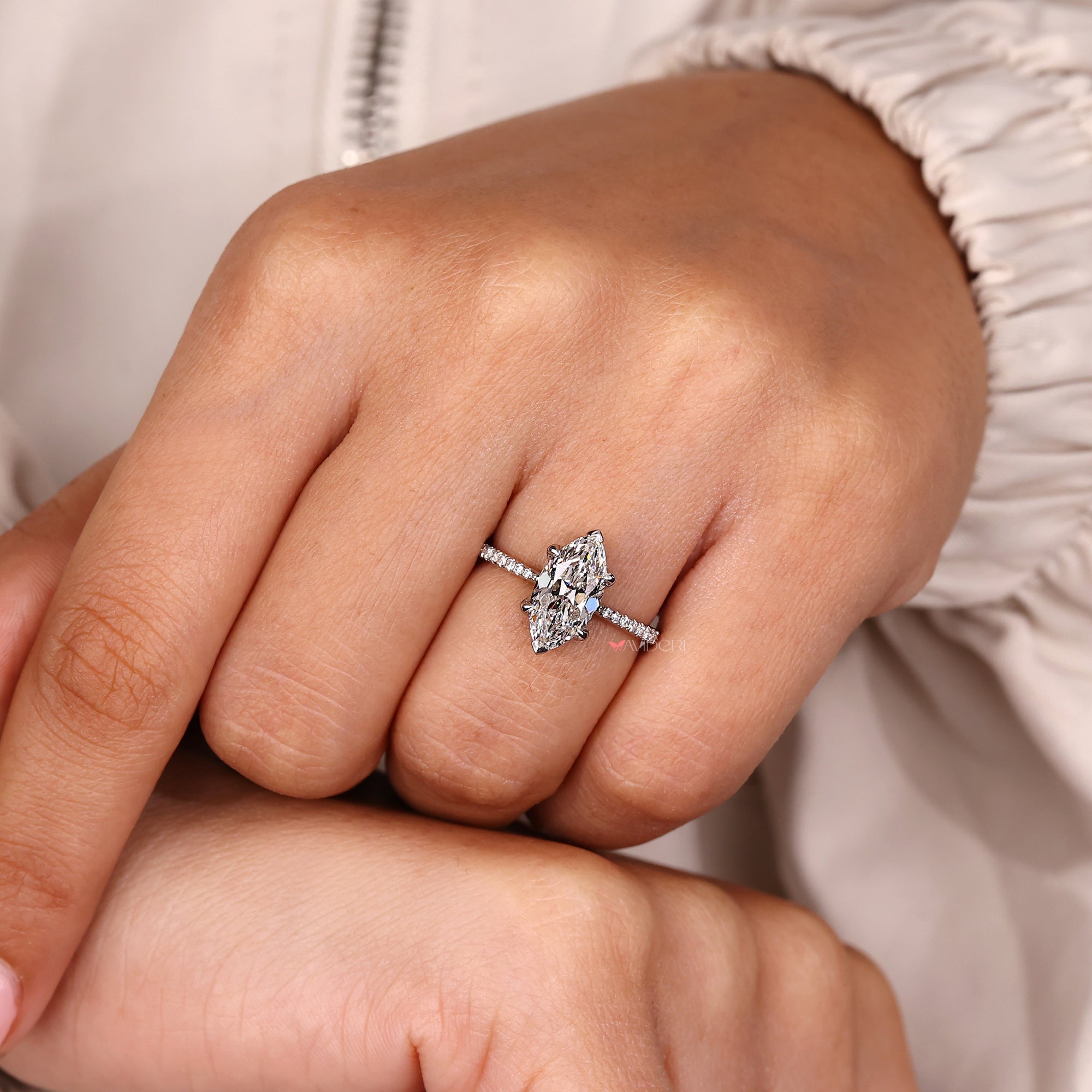 V shaped prong ring showcasing an old European cut diamond.