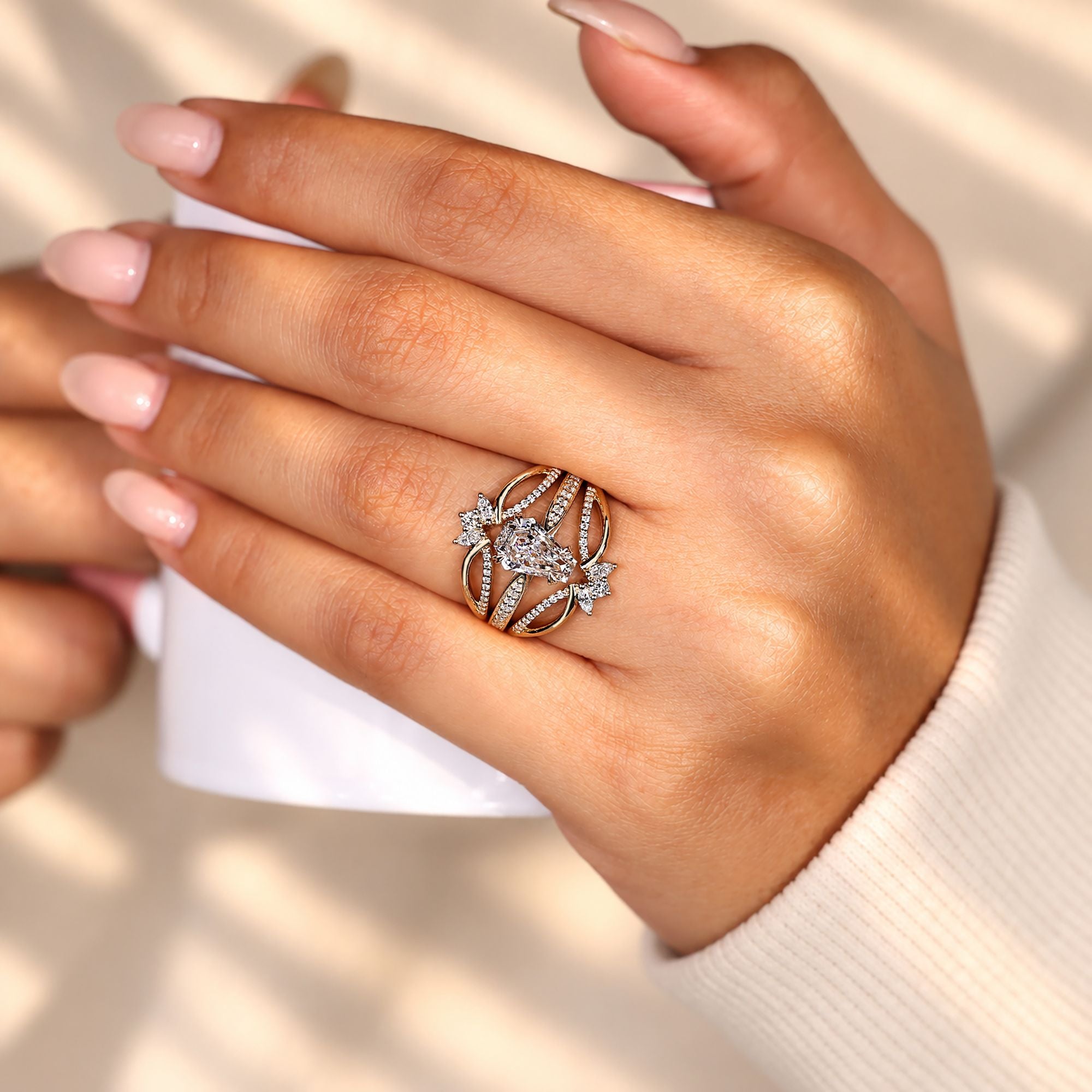 Coffin cut engagement ring with cathedral setting.
