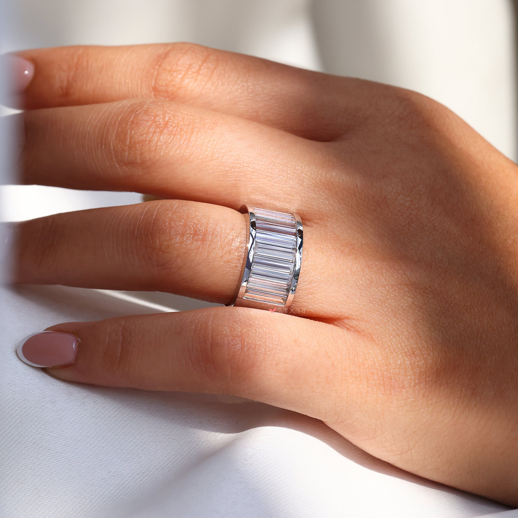 Diamond wedding band in white gold for daily wear.
