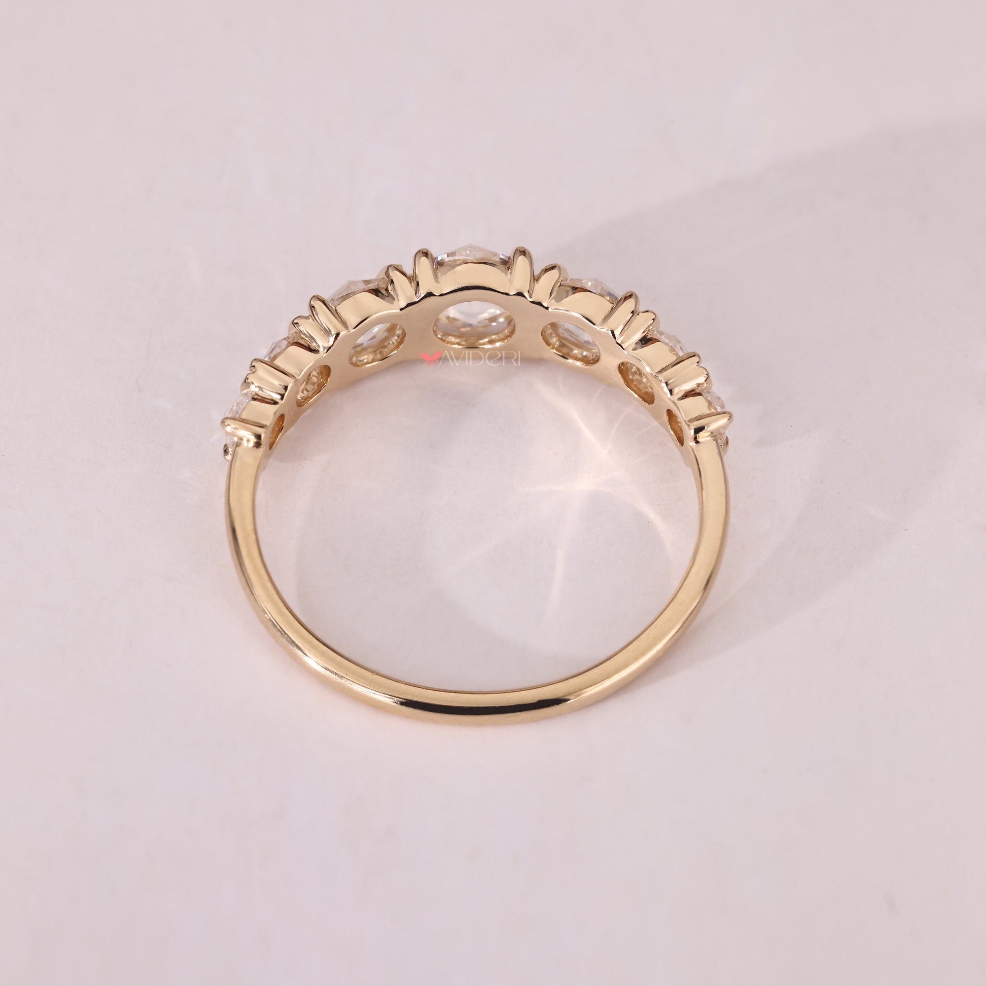 Moissanite wedding band sparkles bright.
