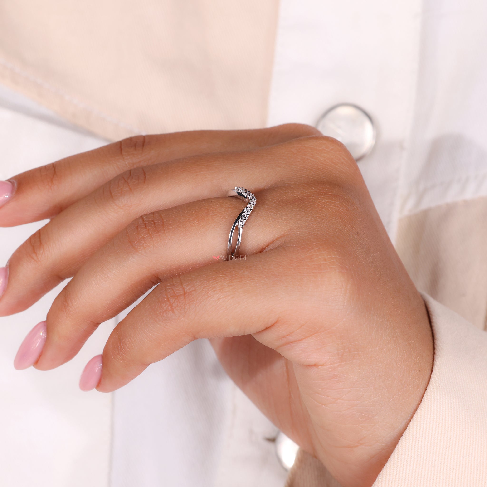 Round diamond eternity band set in a curved wedding band for perfect shine.

