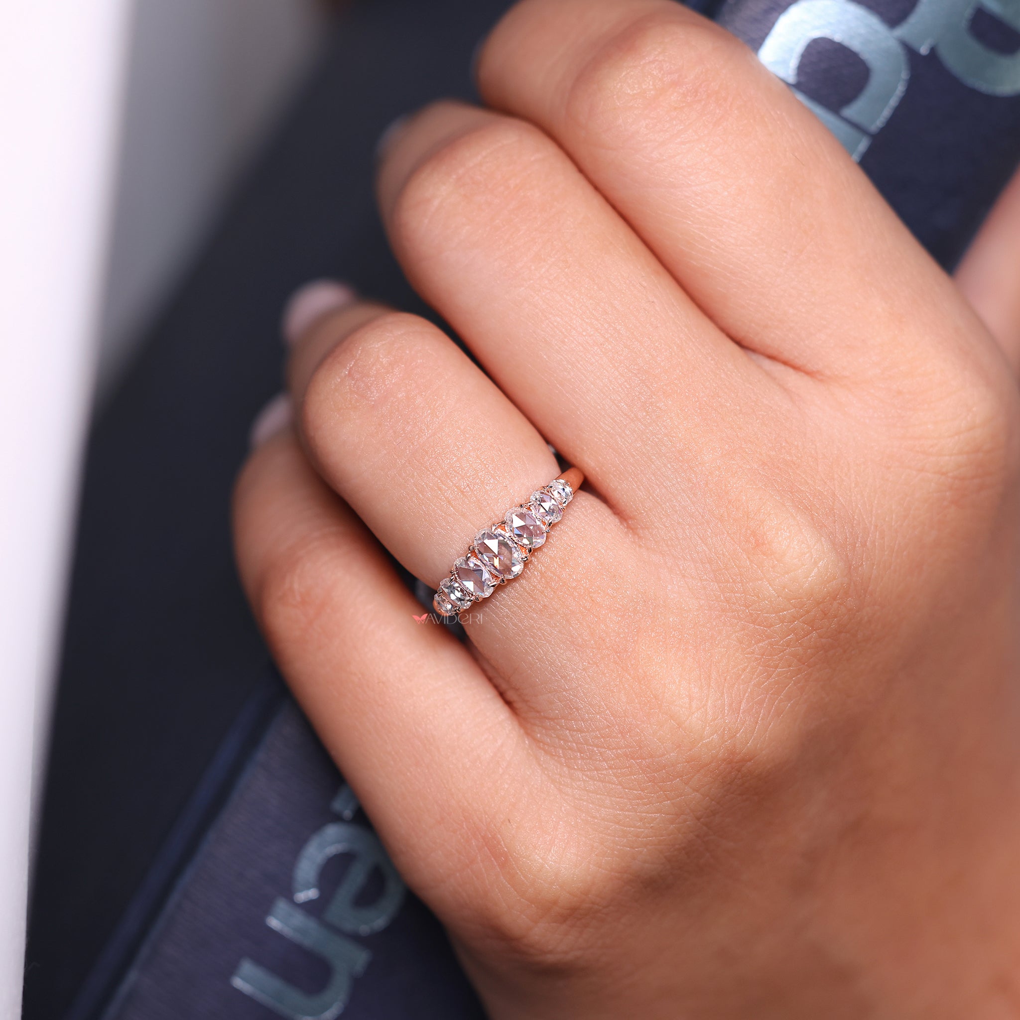 Oval wedding band featuring a stunning rose cut design.
