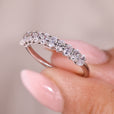 Oval cut diamond band with shared prong design.