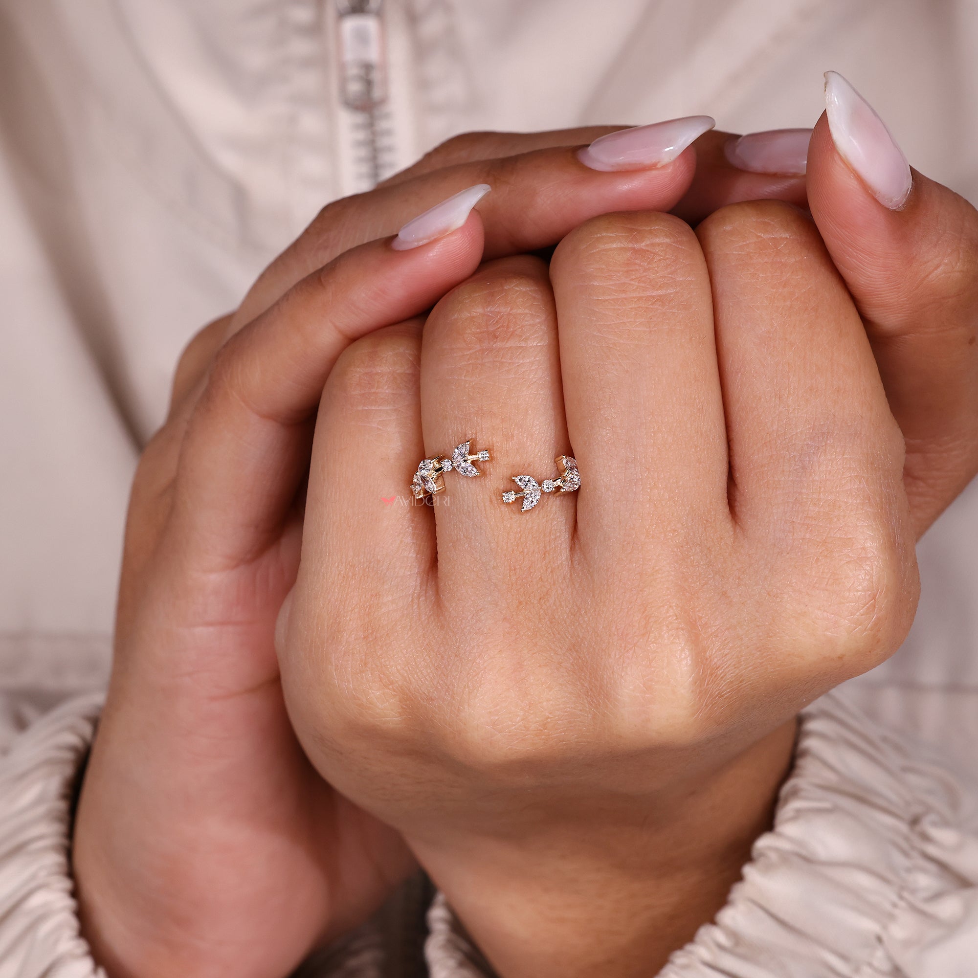 Elegant open gap diamond band with nature detail.
