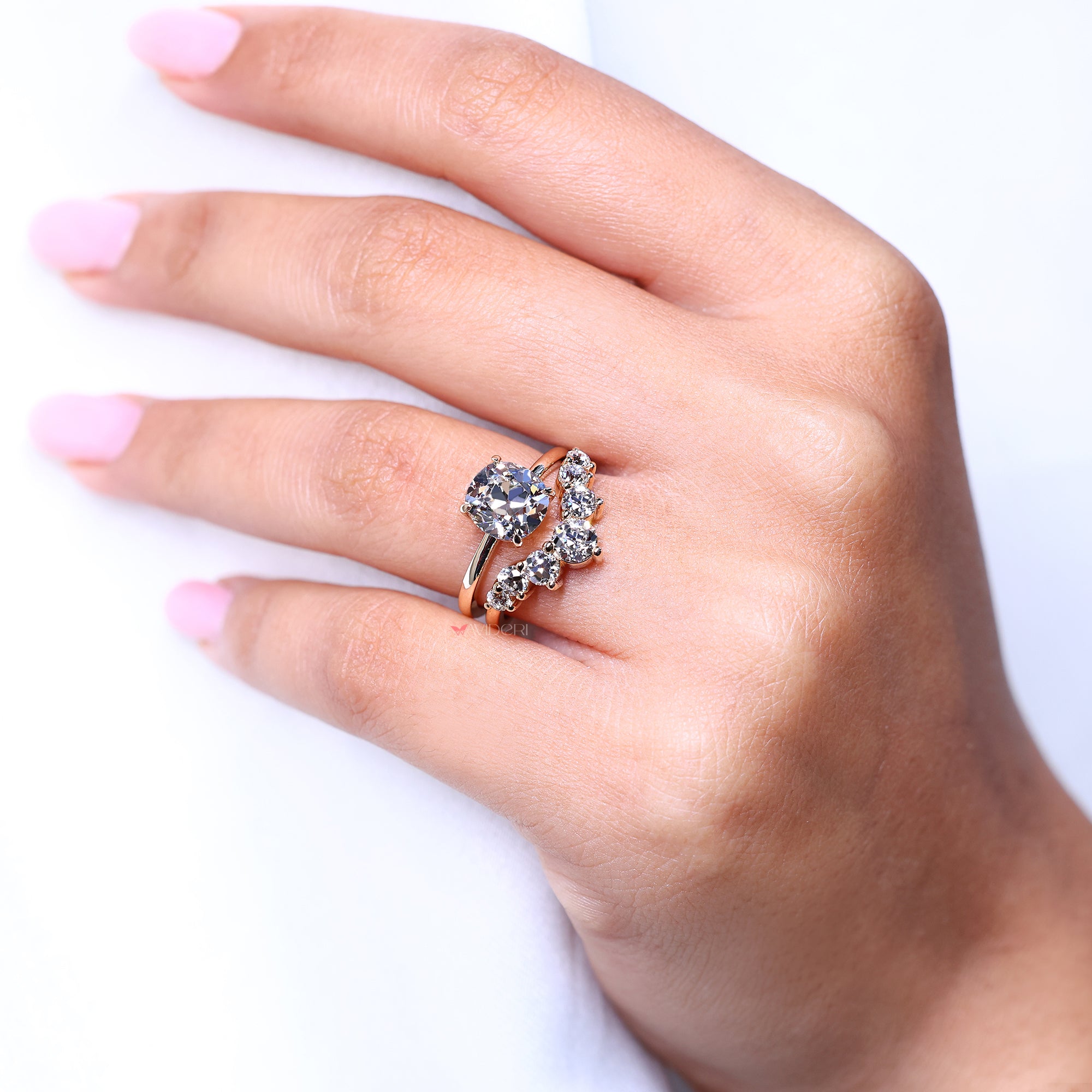 Old European cut diamond band sparkles with round diamonds.