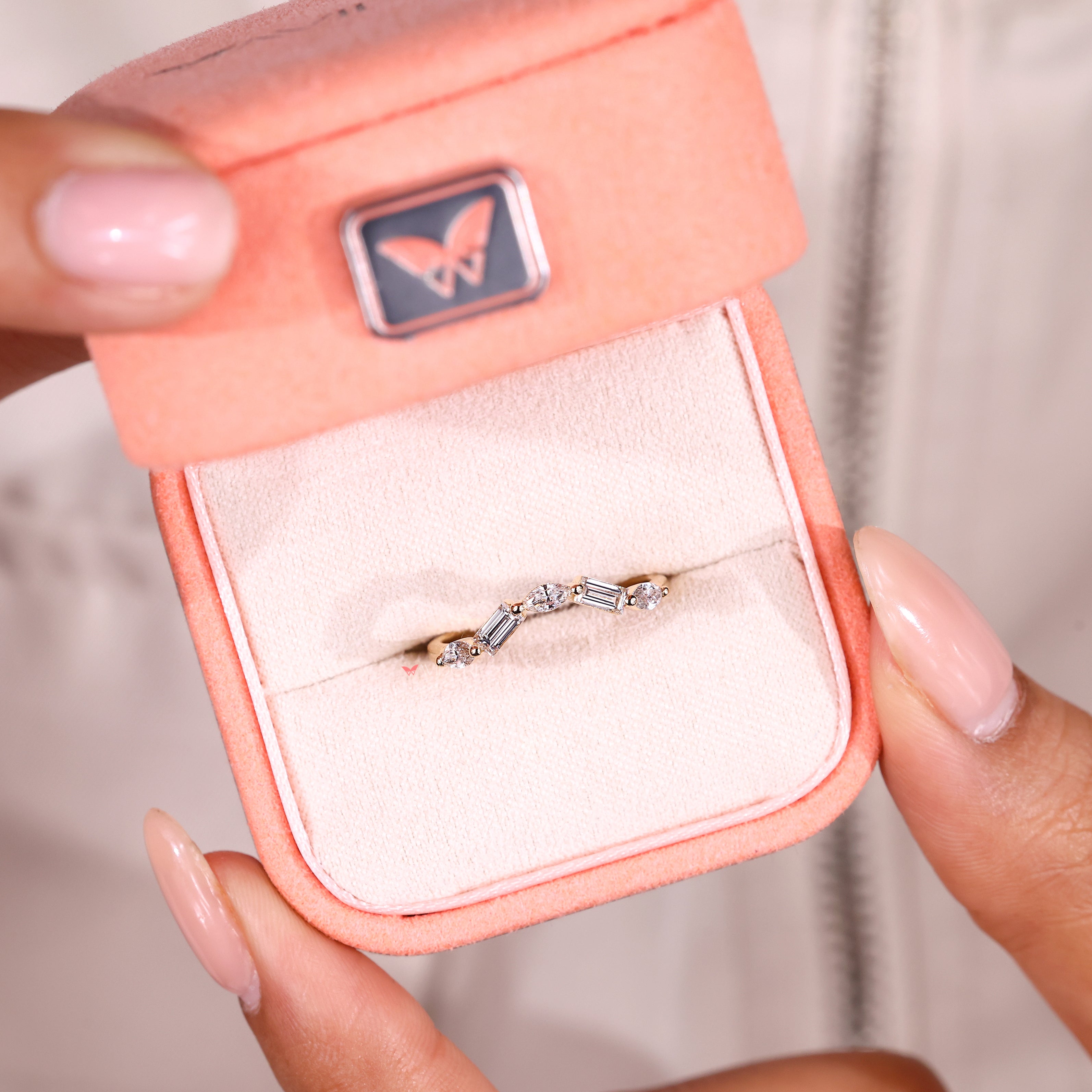 Five stone diamond band with curved wedding ring design.
