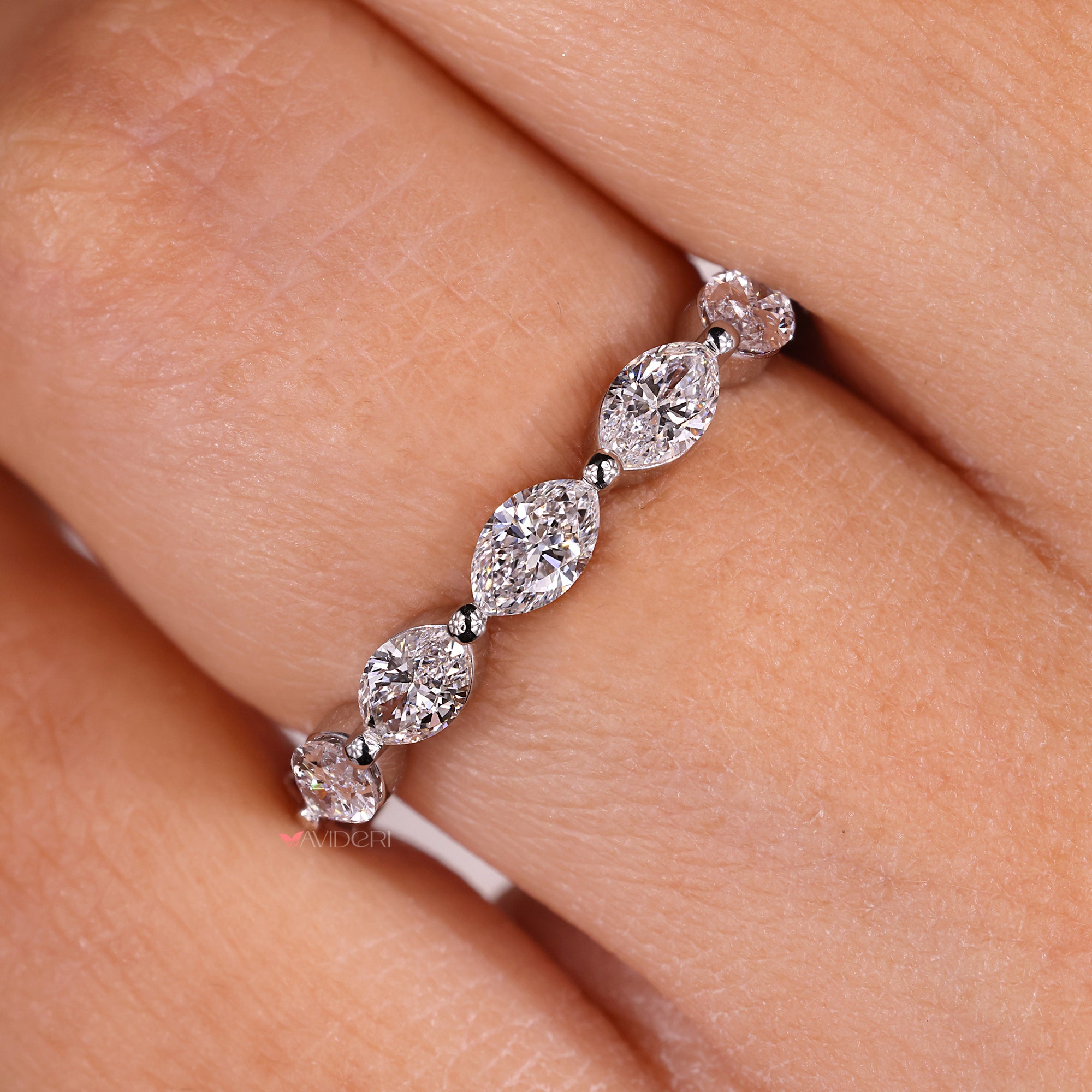 White gold wedding band with marquise diamond wedding band.