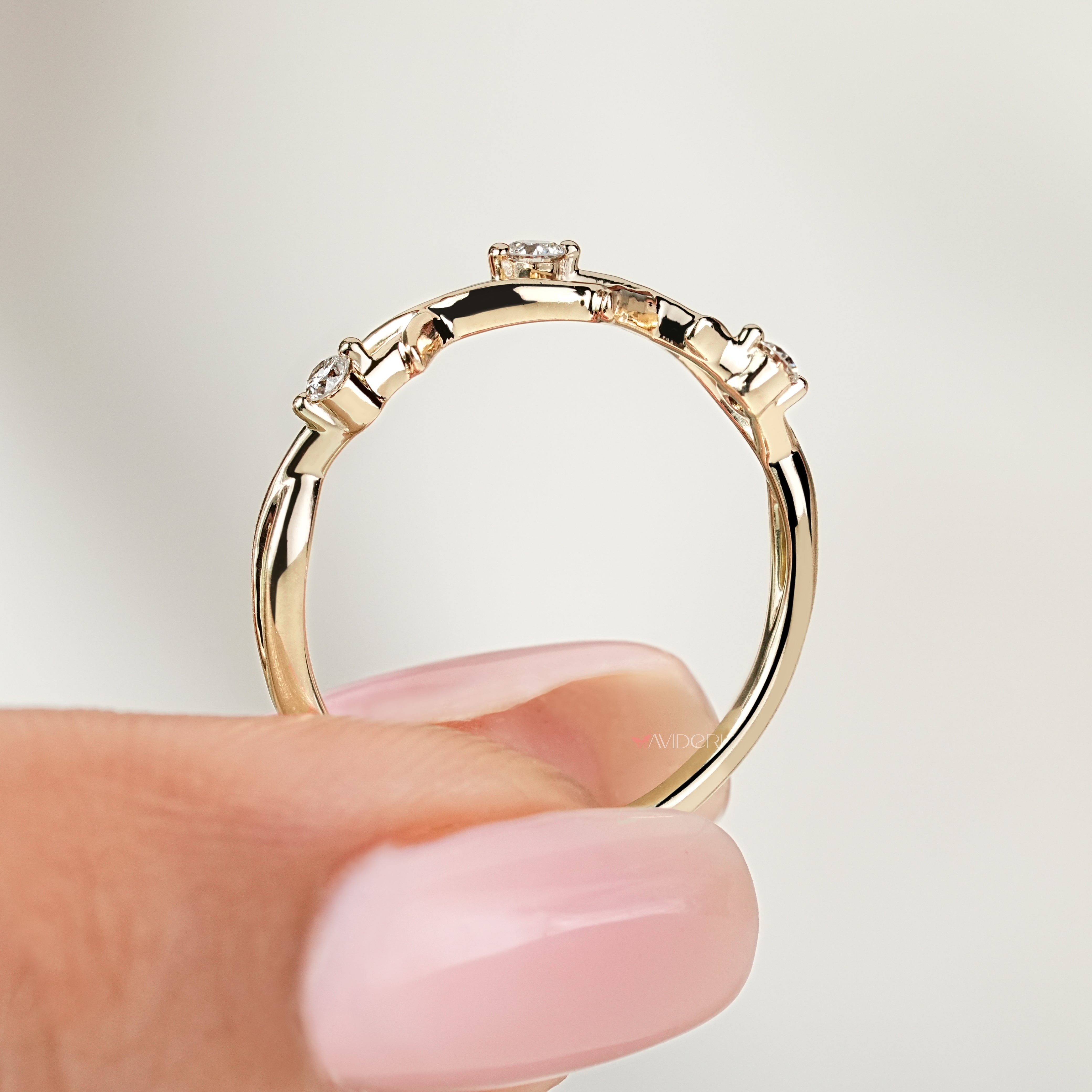 Round diamond wedding band with twisted nature inspired pattern

