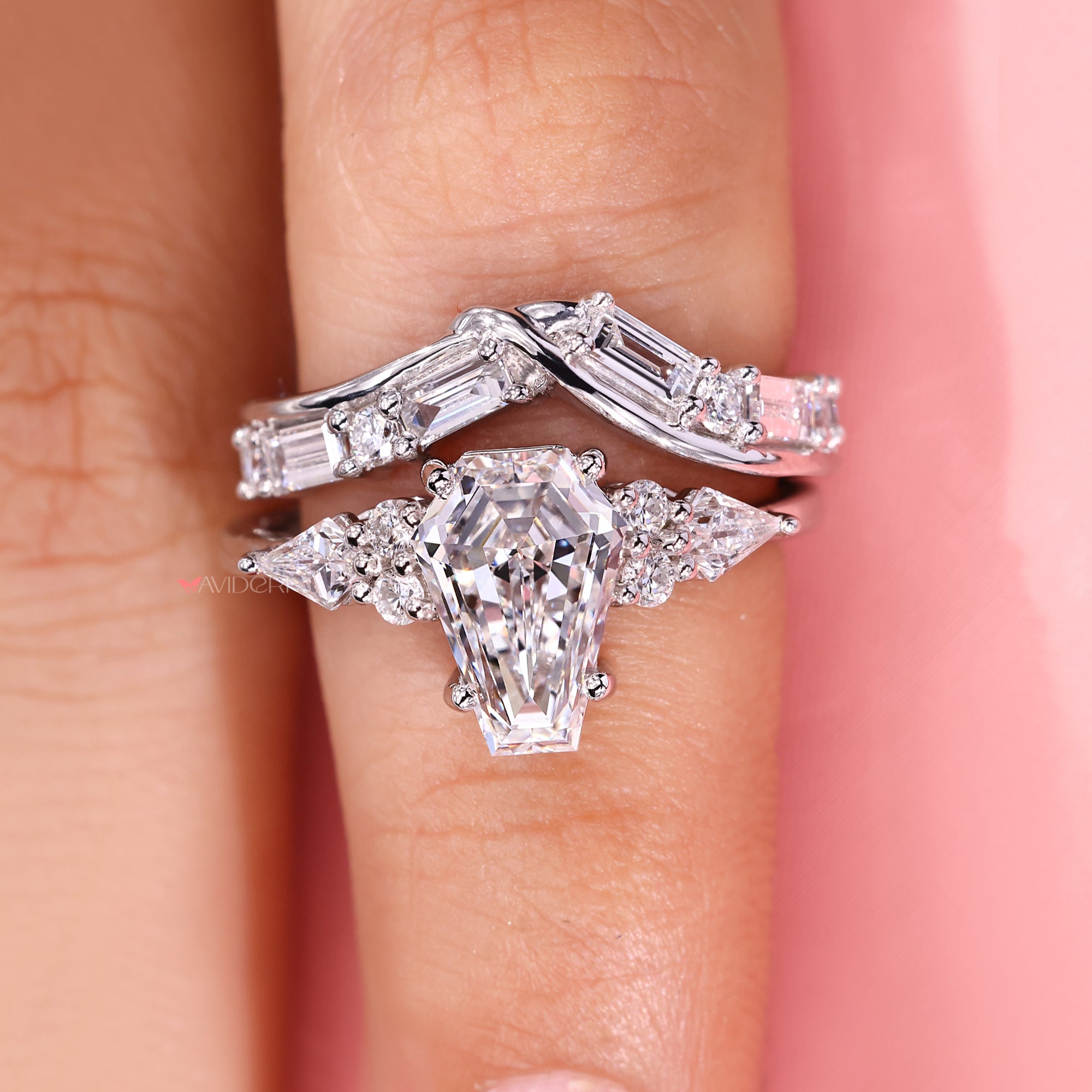 Round cut wedding band stacked with a matching ring.