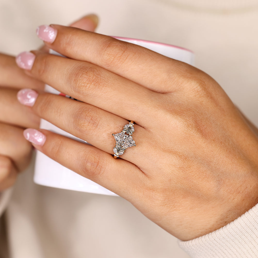 Nature inspired Dutch marquise ring with side leaves.
