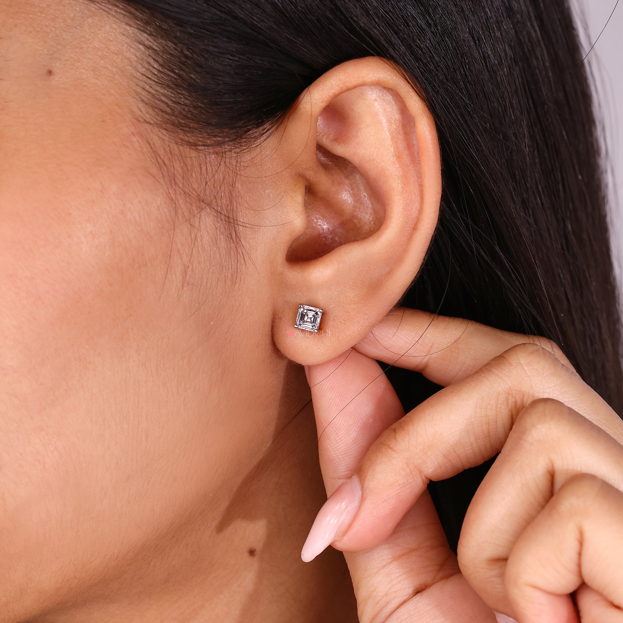 Buy diamond earrings with precision cut Asscher stones.