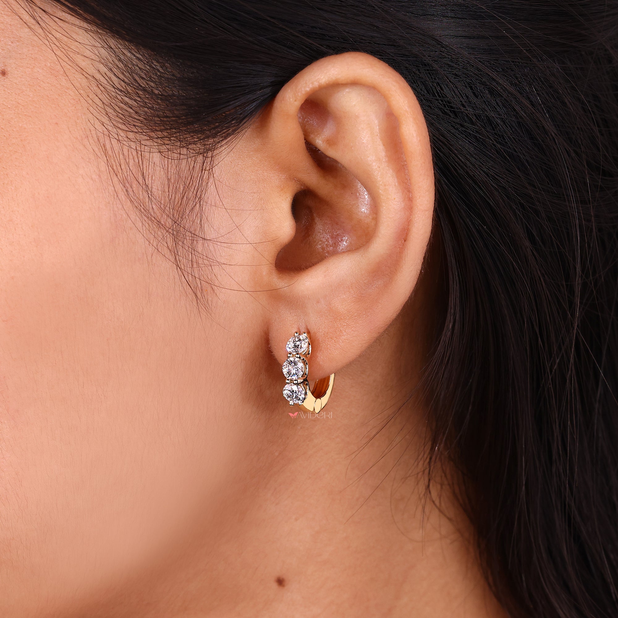 Lab Grown Diamond with gold diamond hoop earrings.