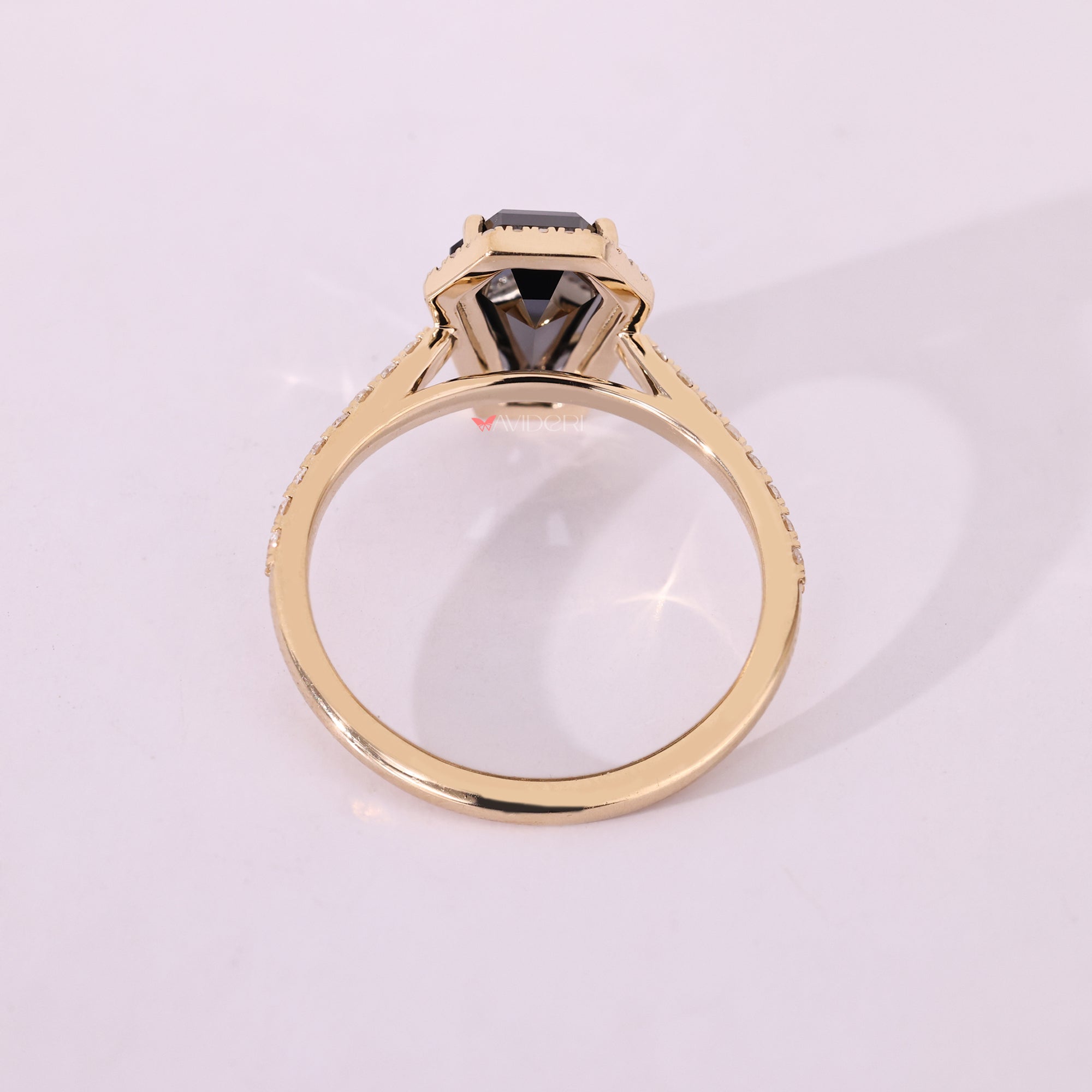 Cathedral set engagement ring with 4 prong setting.