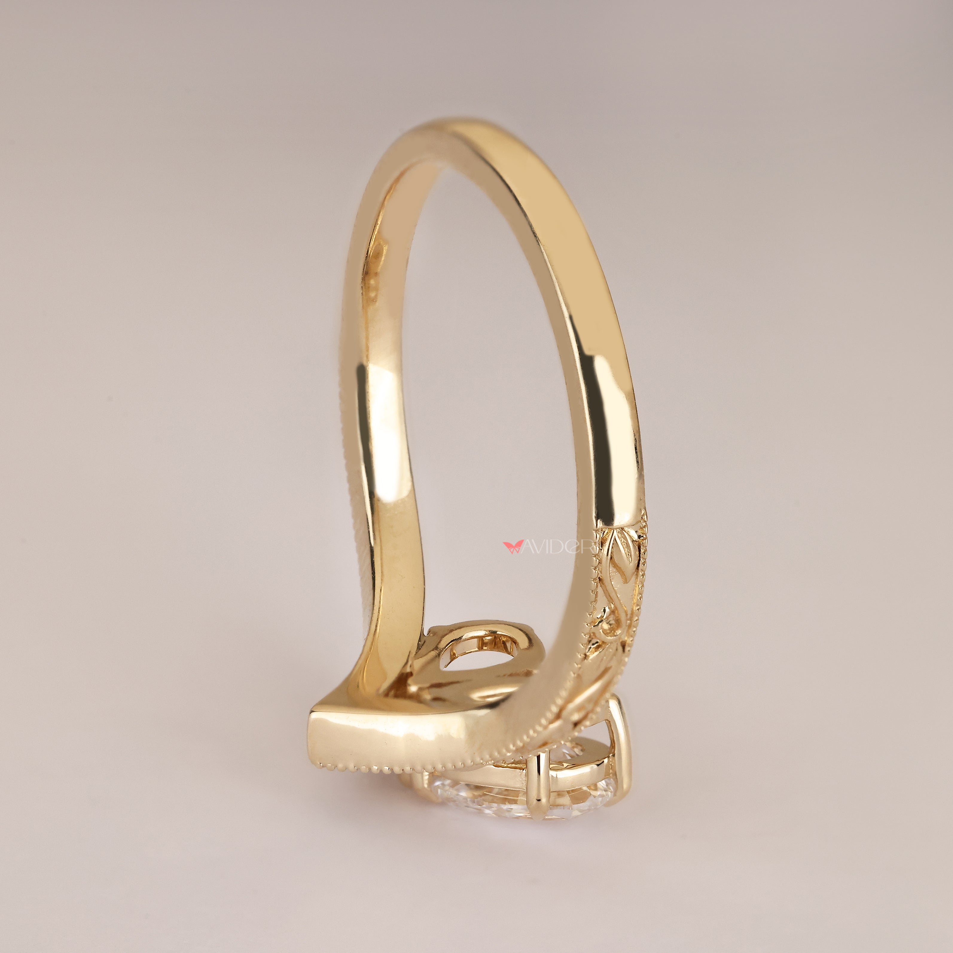 Handmade pear diamond ring with vintage filigree.
