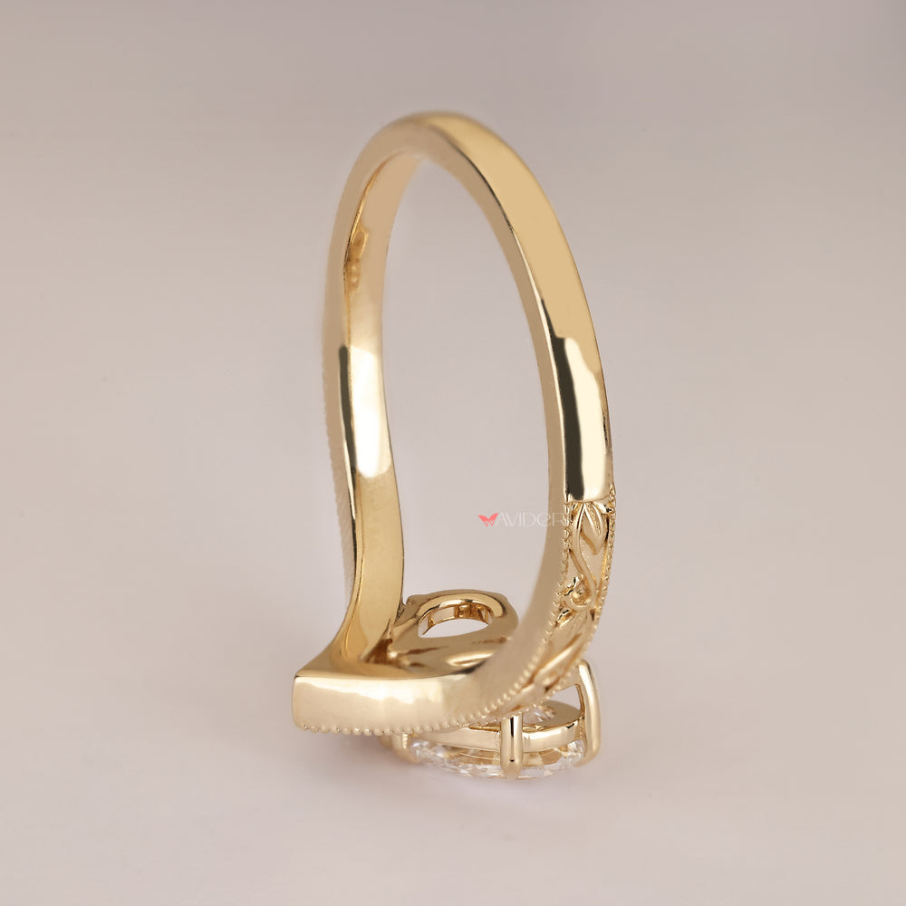 Handmade pear diamond ring with vintage filigree.
