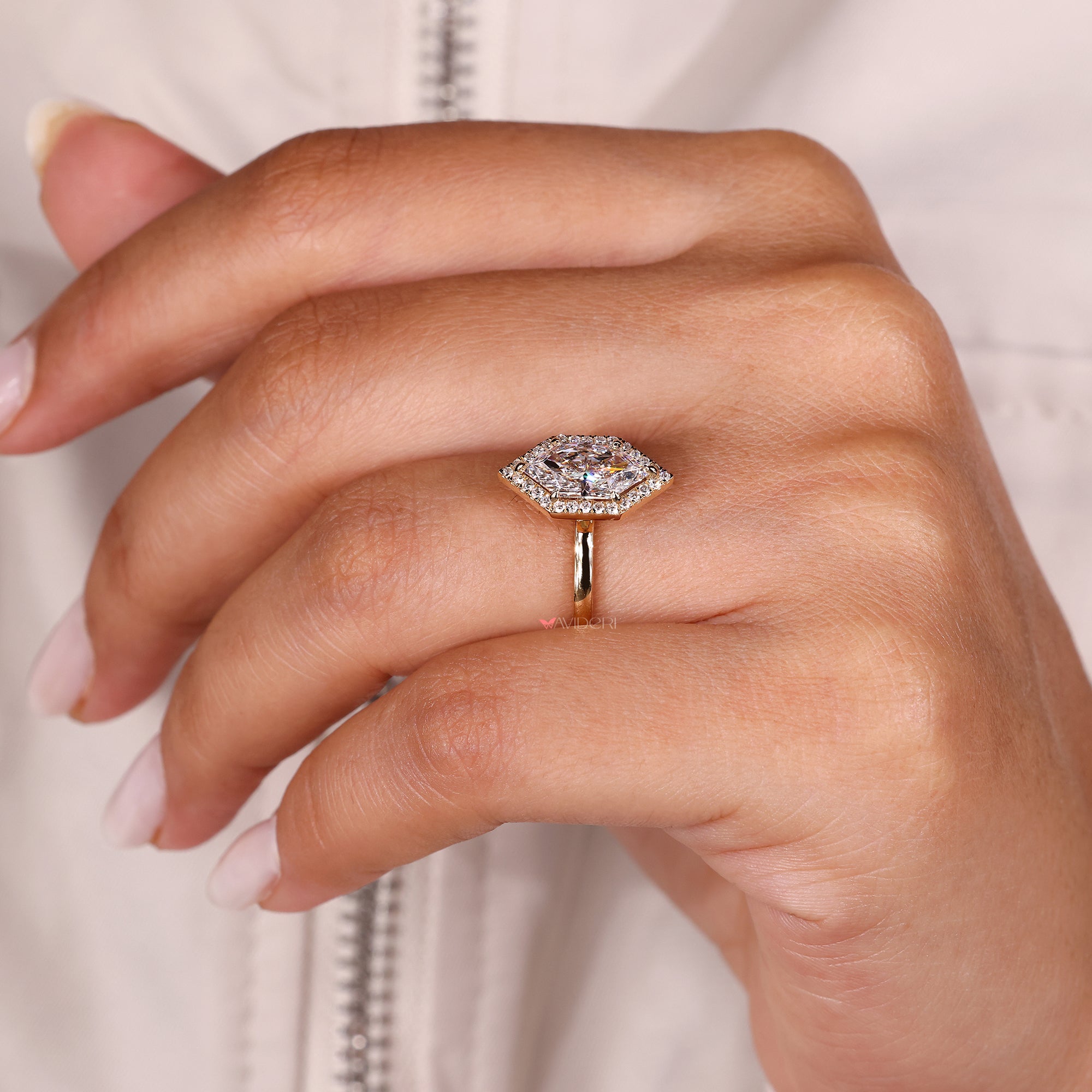 Round diamond halo setting designed with solitaire engagement ring.